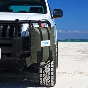 a military coloured 20L jerry bag filled with water and strapped to a bullbar