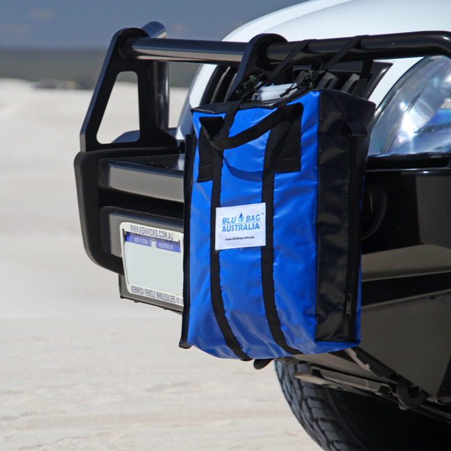A blue jerry bag strapped to the front of a 4WD